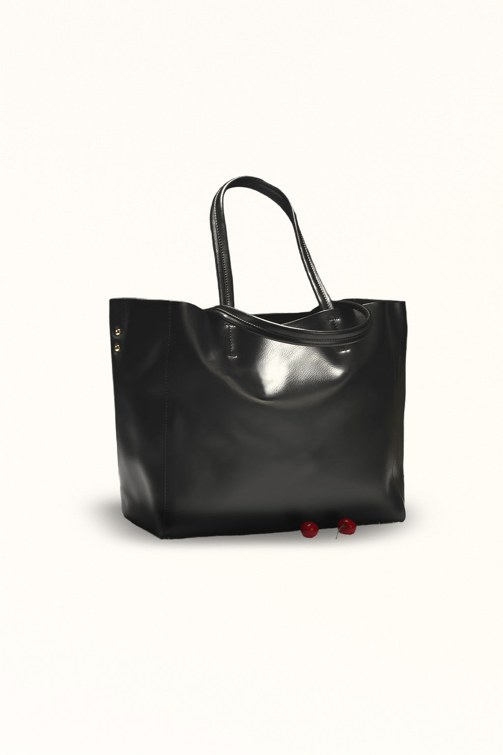 Black leather handbag with soft texture and versatile carry options