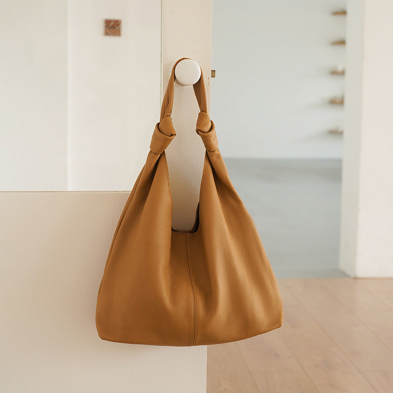Brown leather underarm bag for women with sewing thread detail