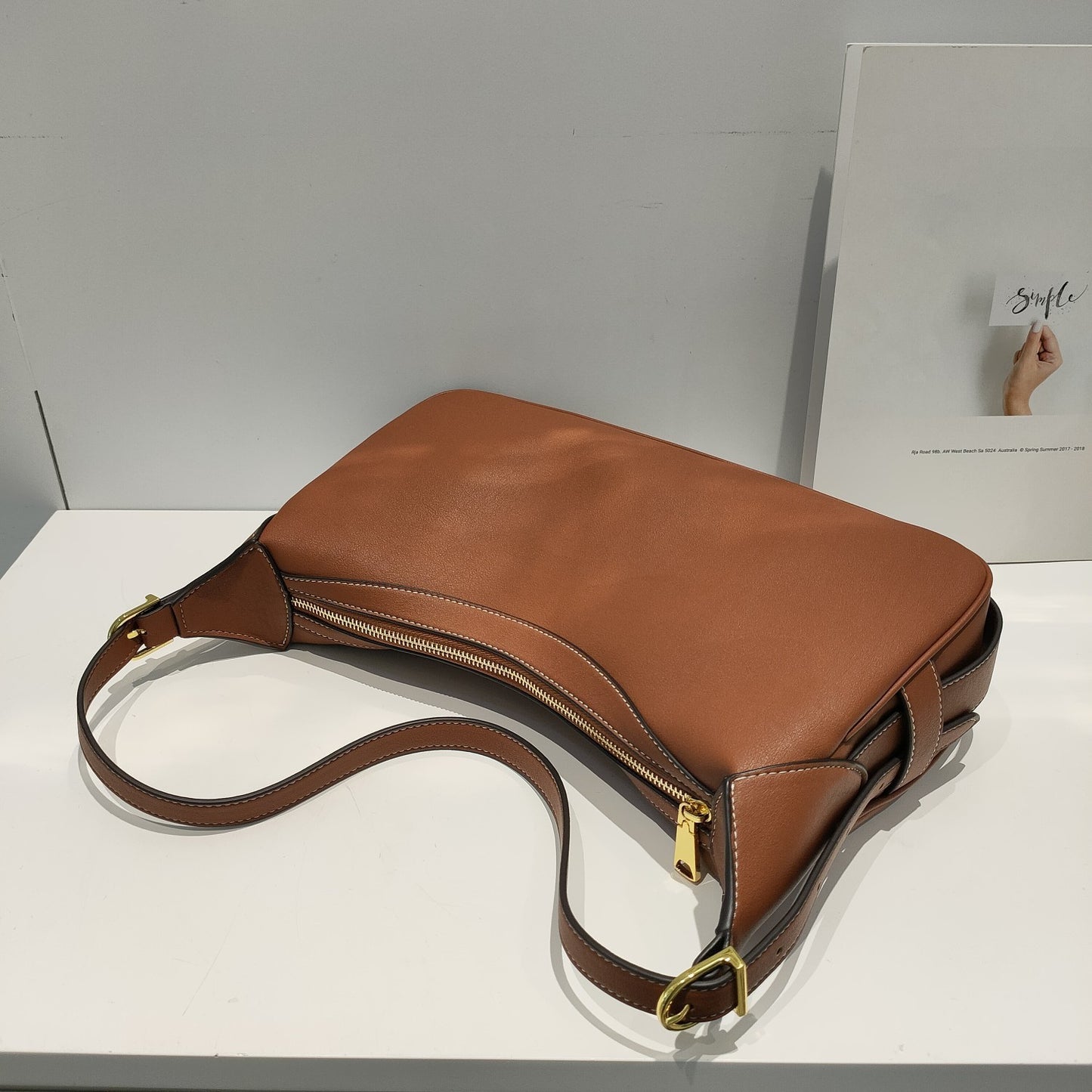 Fashion leather one-shoulder bag with chain detail and sleek urban shape