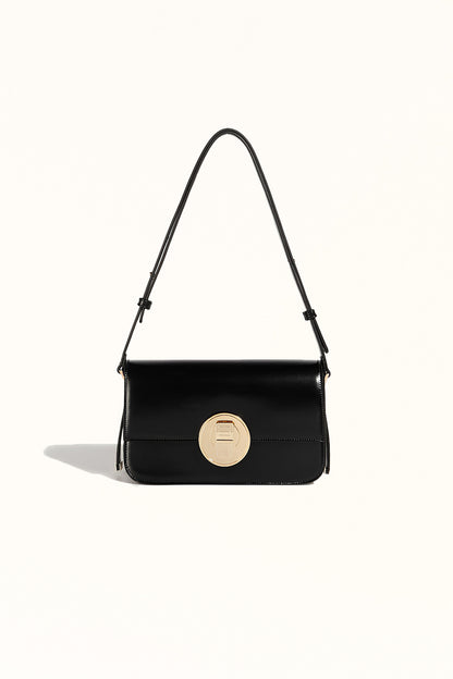 Black leather crossbody bag with structured square shape and secure lock