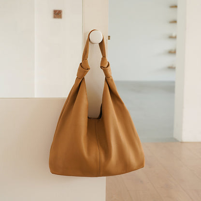 Brown leather underarm bag for women with sewing thread detail