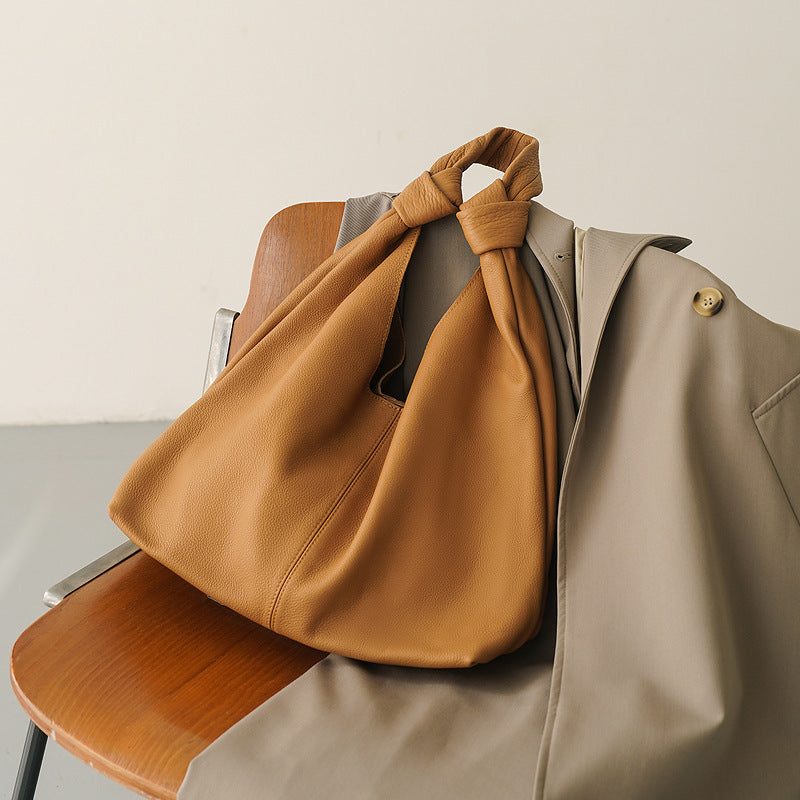 Women's brown leather shoulder bag with square shape and soft structure